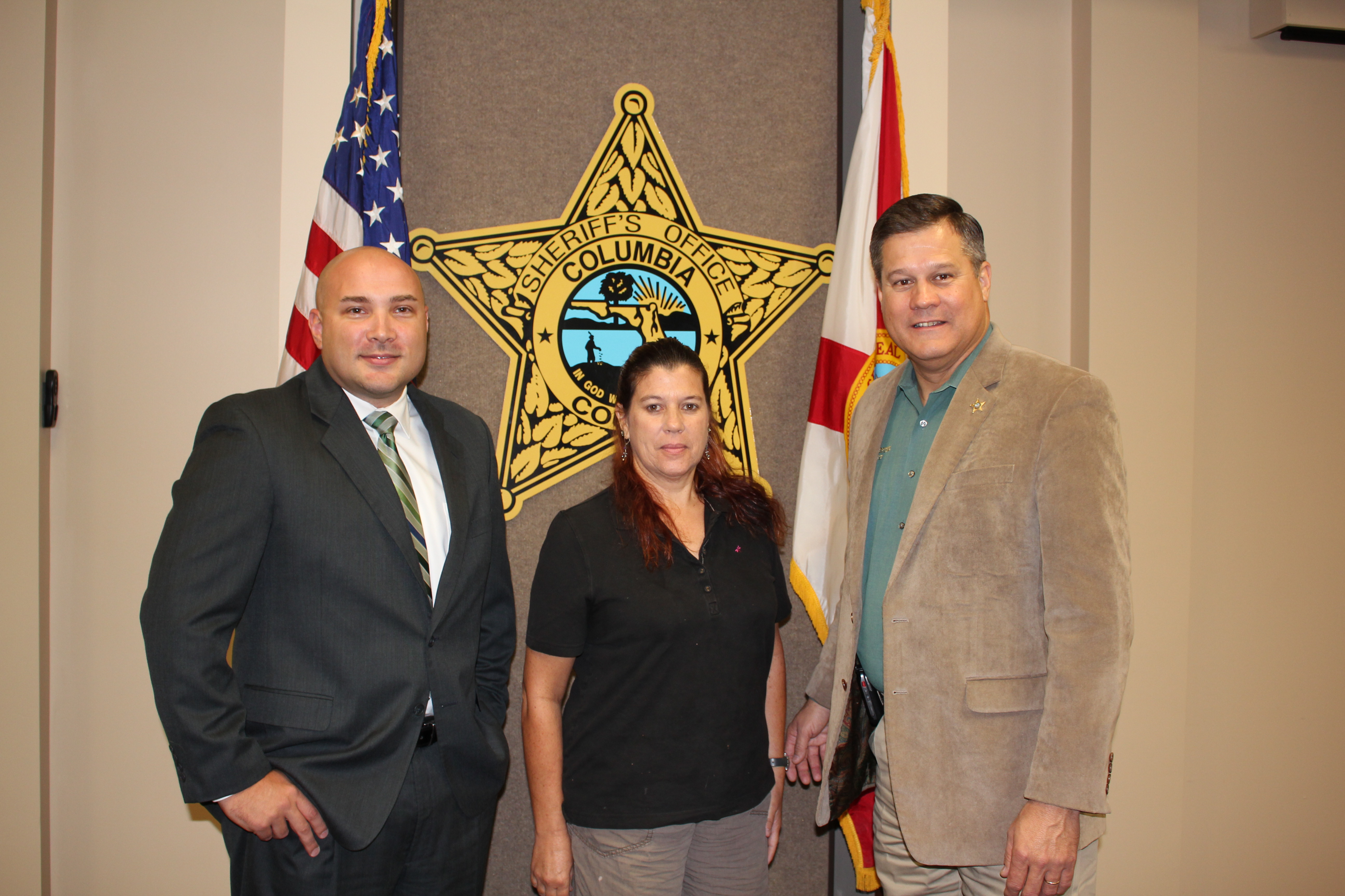 Deputy Kevin Cox, Ms. Martha Adams, and Sheriff Mark Hunter