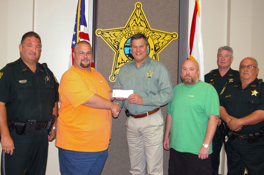 Sheriff Mark Hunter was given a $600 check from Elks Lodge #893 to help with expenses of two summer youth camps hosted by the Columbia County Sheriff's Office and Florida Sheriffs Youth Ranches.







The camps  provide two weeks of fun and education for over 120 local students. Each week long camp, one in Lake City and one in Fort White,  focus' on helping the students learn about and interact with Deputies and other first responders.