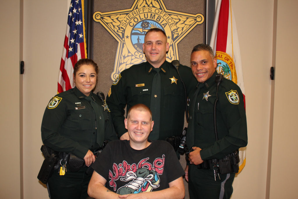 Sheriff Promotes One and Awards Three Life Saving Medals