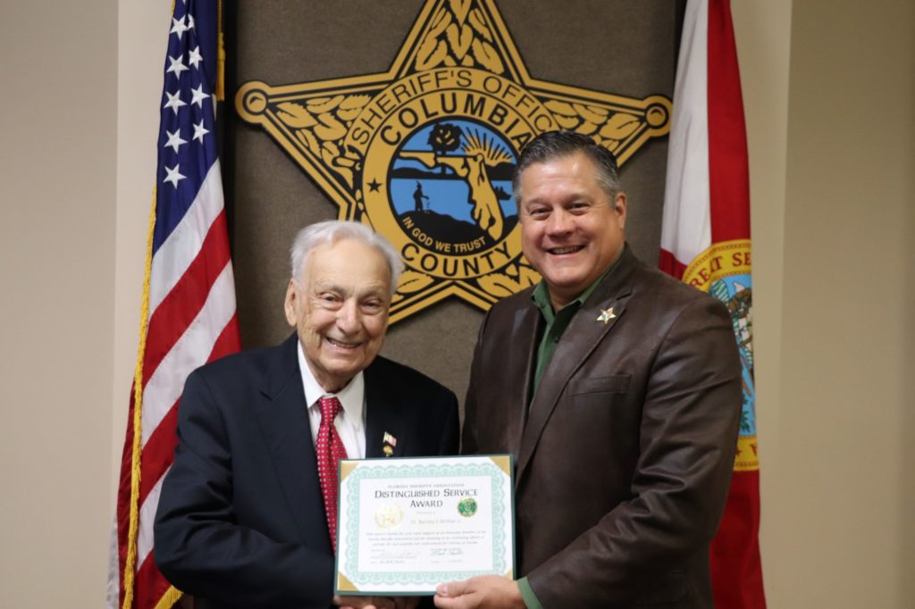 Sheriff Hunter presents Distinguished Service Award