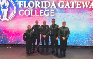 FGC Basic LEO Graduation photo of Cassandra Hall, Troy Schlicht, Sheriff Wallace Kitchings, Dallas Sapp, and Matthew Laux